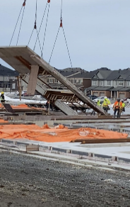 Picture of a wall going up in a construction zone